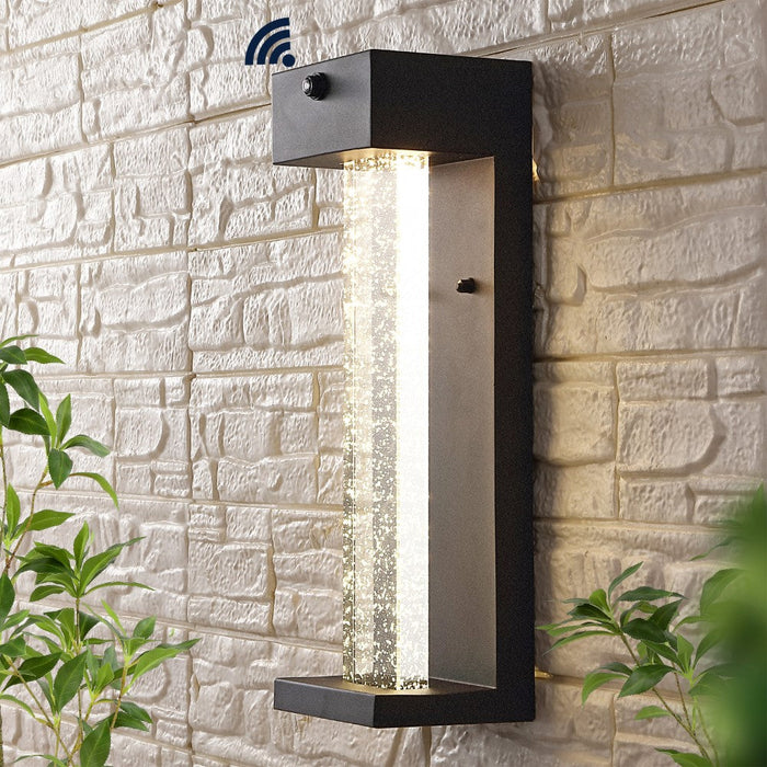 Turbo 5.13" Modern Industrial Iron/Glass Seeded Glass with Dusk-to-Dawn Sensor Integrated LED Outdoor Sconce