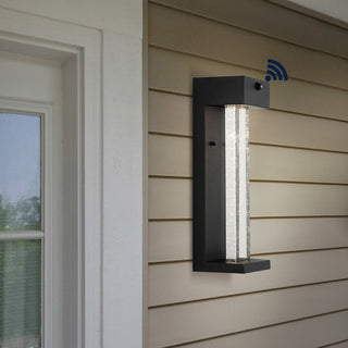 Turbo 5.13" Modern Industrial Iron/Glass Seeded Glass with Dusk-to-Dawn Sensor Integrated LED Outdoor Sconce