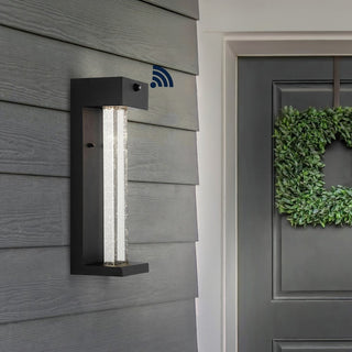 Turbo 5.13" Modern Industrial Iron/Glass Seeded Glass with Dusk-to-Dawn Sensor Integrated LED Outdoor Sconce