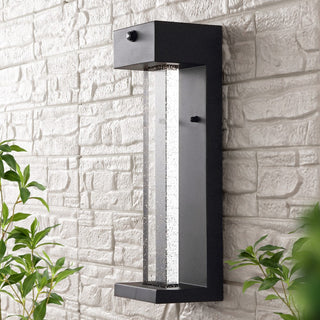 Turbo 5.13" Modern Industrial Iron/Glass Seeded Glass with Dusk-to-Dawn Sensor Integrated LED Outdoor Sconce