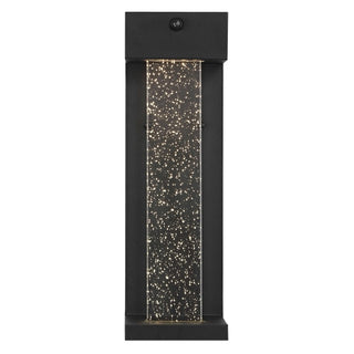 Turbo 5.13" Modern Industrial Iron/Glass Seeded Glass with Dusk-to-Dawn Sensor Integrated LED Outdoor Sconce