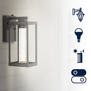 Shoji 4.75" Industrial Vintage Iron/Glass Seeded Glass with Dusk-to-Dawn Sensor Integrated LED Outdoor Sconce