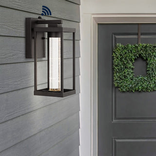 Shoji 4.75" Industrial Vintage Iron/Glass Seeded Glass with Dusk-to-Dawn Sensor Integrated LED Outdoor Sconce