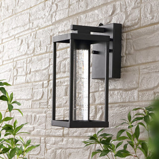 Shoji 4.75" Industrial Vintage Iron/Glass Seeded Glass with Dusk-to-Dawn Sensor Integrated LED Outdoor Sconce