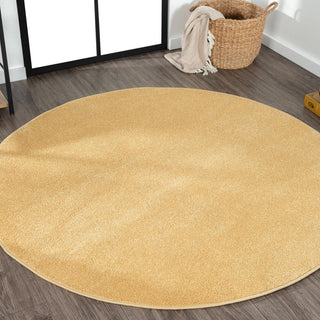 Trivor Haze Solid Low-Pile Area Rug Mustard