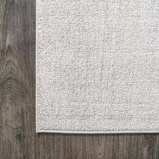 Trivor Haze Solid Low-Pile Area Rug Ivory