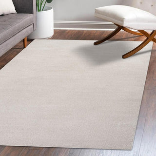 Trivor Haze Solid Low-Pile Area Rug Ivory