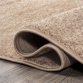 Trivor Haze Solid Low-Pile Area Rug Beige