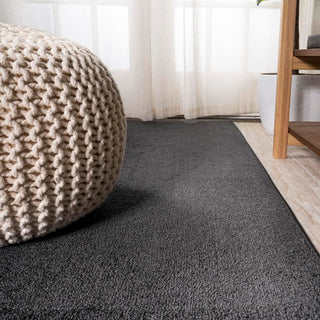 Trivor Haze Solid Low-Pile Area Rug Black