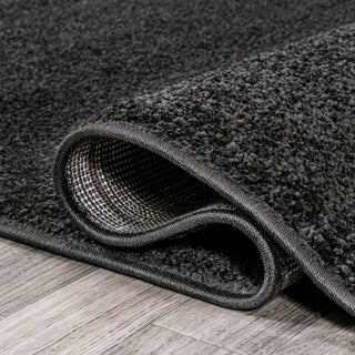 Trivor Haze Solid Low-Pile Area Rug Black