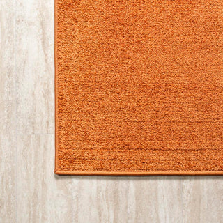 Trivor Haze Solid Low-pile Area Rug Orange