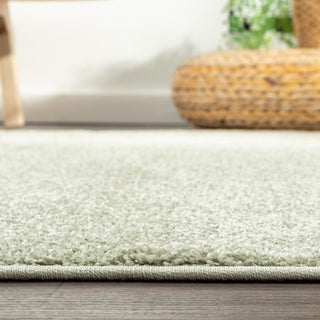 Trivor Haze Solid Low-pile Area Rug Green