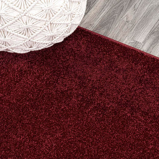 Trivor Haze Solid Low-pile Area Rug Dark Red