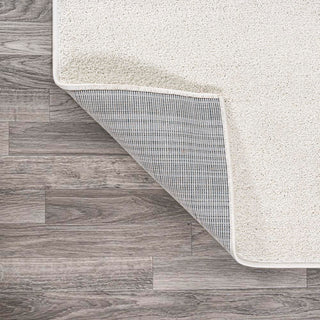 Trivor Haze Solid Low-pile Area Rug Cream