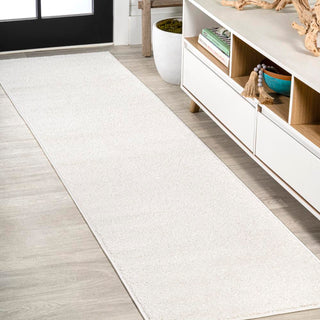 Trivor Haze Solid Low-pile Area Rug Cream