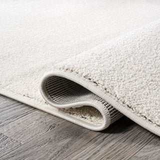 Trivor Haze Solid Low-pile Area Rug Cream