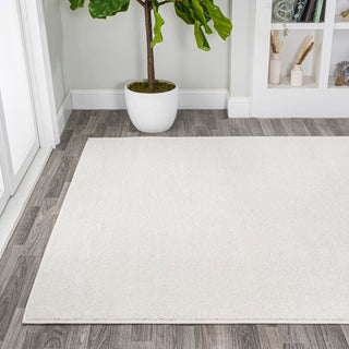 Trivor Haze Solid Low-pile Area Rug Cream