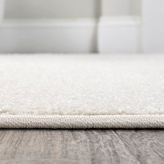 Trivor Haze Solid Low-pile Area Rug Cream