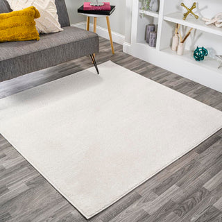 Trivor Haze Solid Low-pile Area Rug Cream