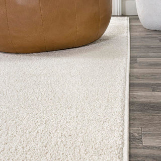 Trivor Haze Solid Low-pile Area Rug Cream